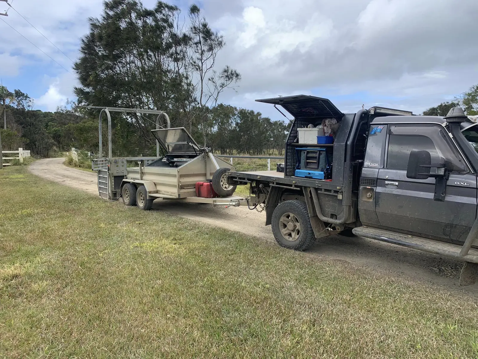NEEVS mobile veterinary vehicle and livestock trailer on a rural property
